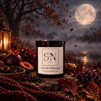 A 9 oz candle jar labeled 'Fall In Moonlight' by Signature Note, styled in an autumn night scene with a full moon, lantern, dried flowers, and leaves.